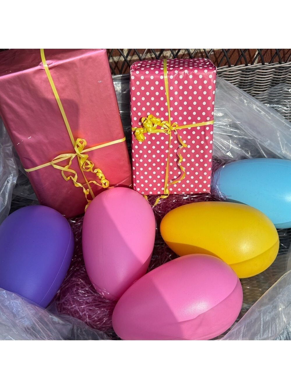 Jumbo Easter eggs and display presents and pink grass decorations Easter display